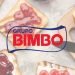 Vemos una imagen del logo de la empresa Bimbo con una imagen detrás de unas tostadas de su pan de molde característico.
